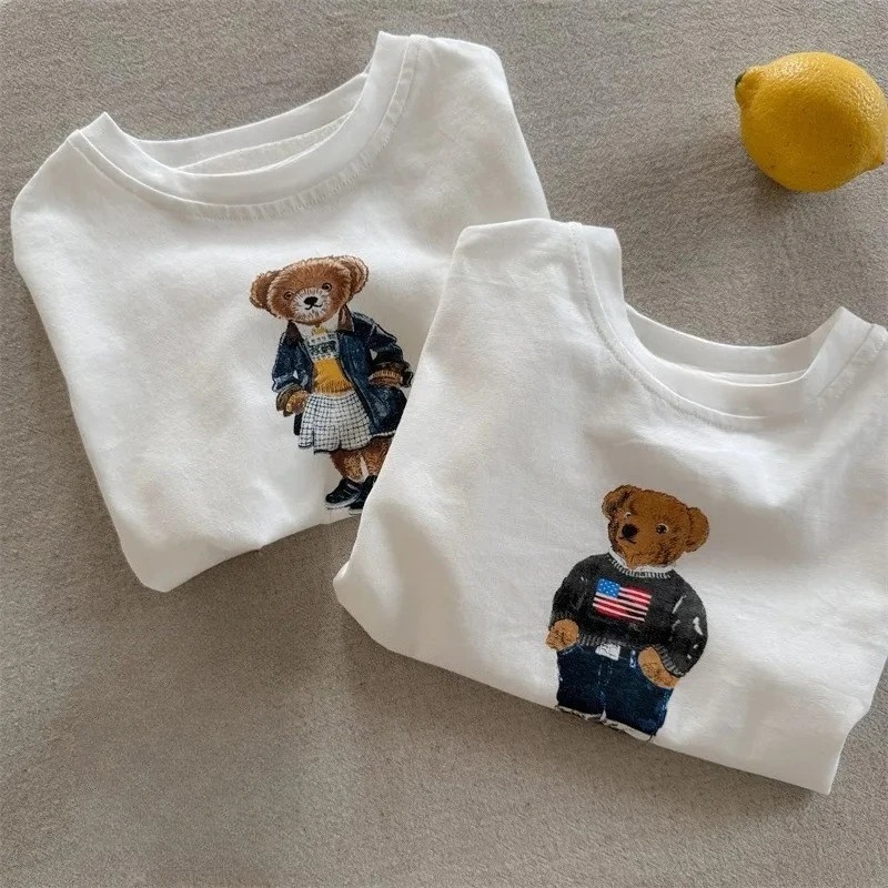 Baby Products Ads - เสื้อยืดเด็กปี 2026 ลายการ์ตูนหมีเท็ดดี้ แขนสั้น น่ารัก สำหรับเด็กชายและเด็กหญิง